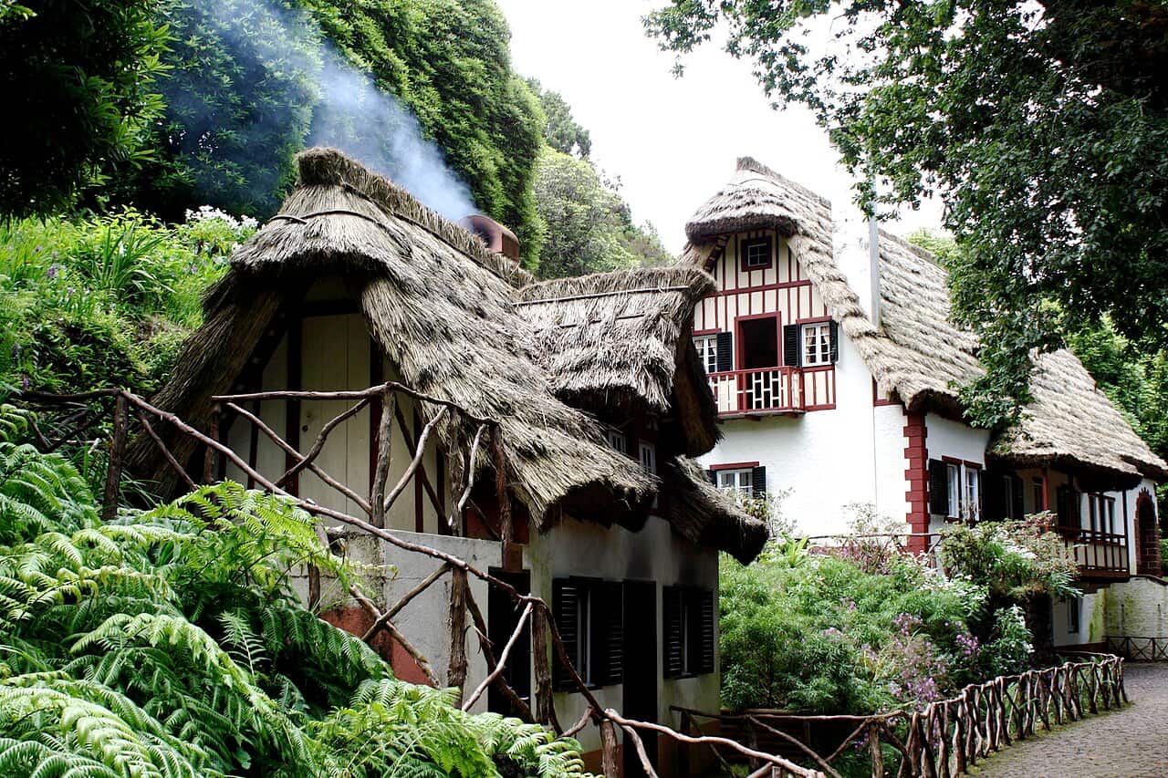 Thatched forest houses at Queimadas surrounded by greenery, at the start of the levada outing.